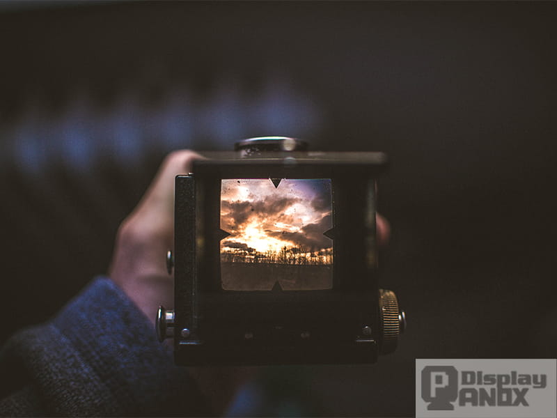 A sunset scene framed through a camera viewfinder.
